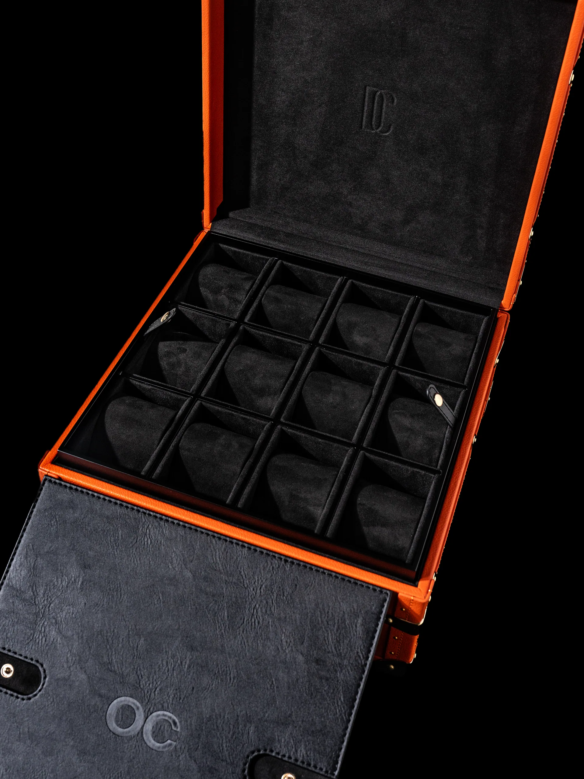 The fitted compartments seen from another angle, orange piping running the edges.