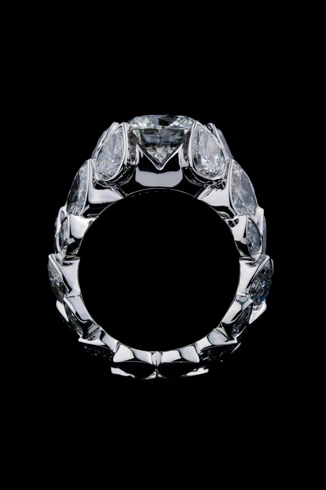 The ring seen through its circle, stones ringing the whole band.