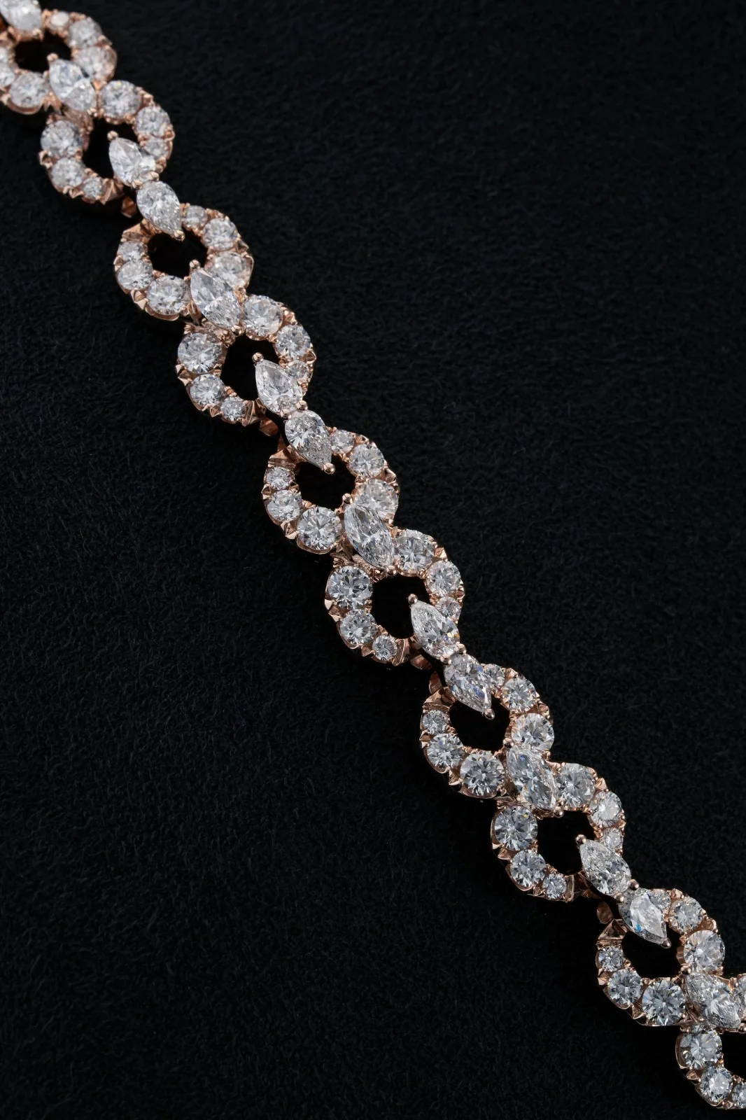 A strand of the chain crossing the frame against near-black.