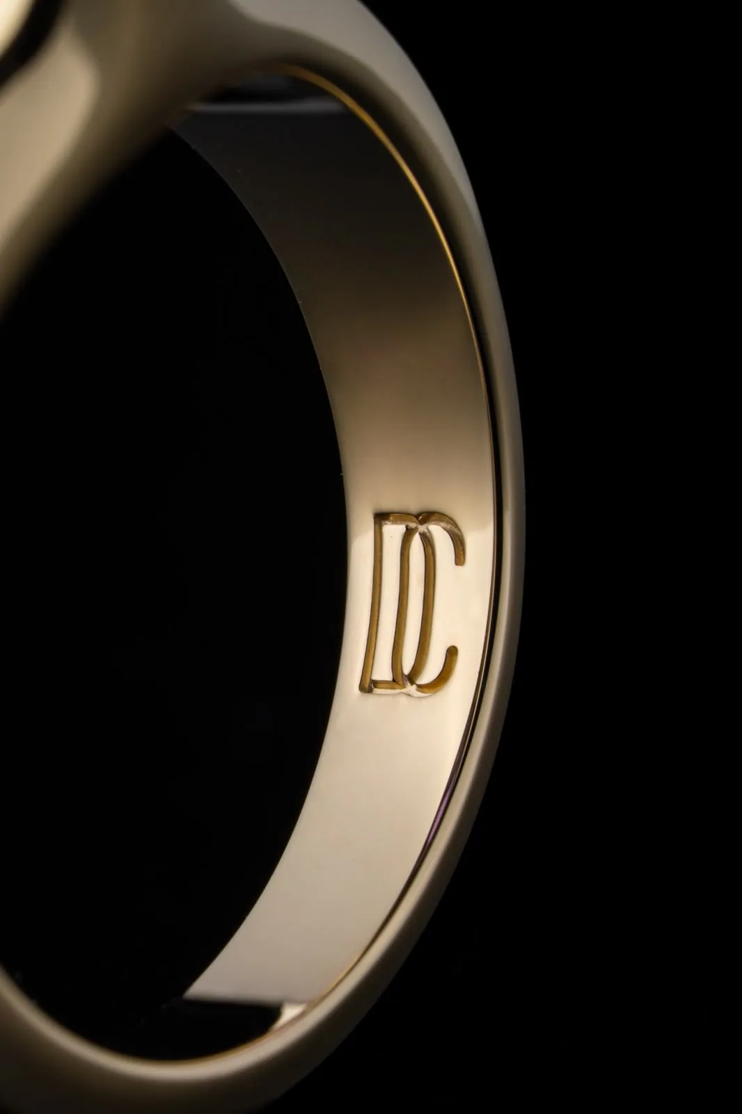 The inside of the band, engraved with the maison's monogram.