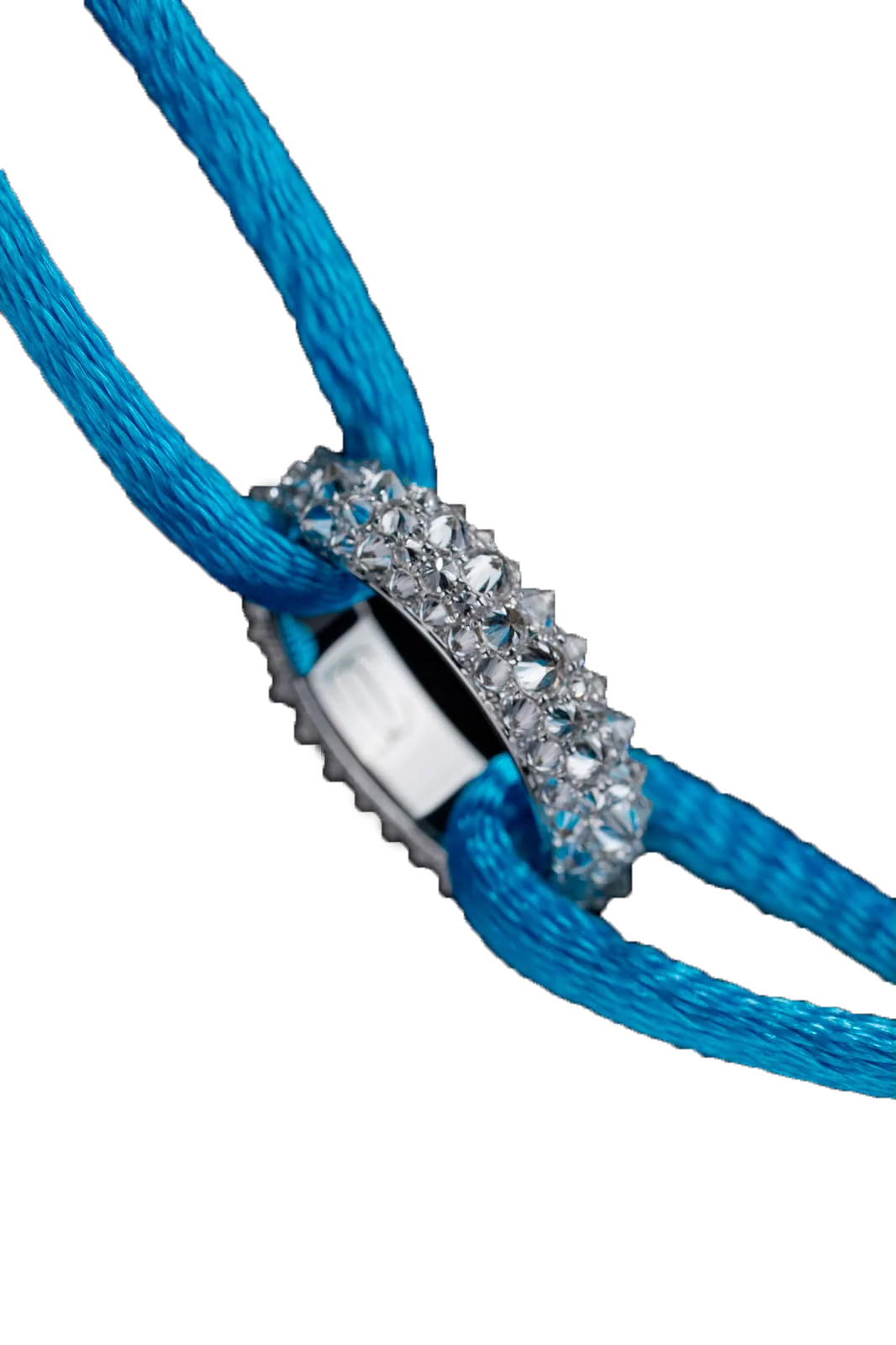 A white-gold ring of diamonds set point upward, threaded on a turquoise silk cord, cut out against near-black.