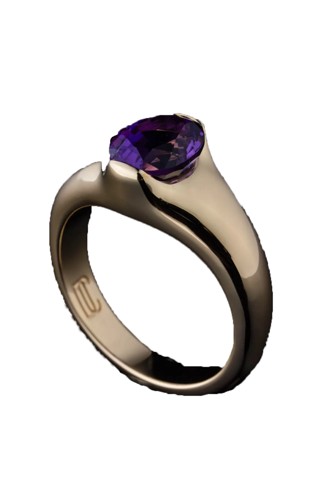 A polished gold ring cut out against near-black, an oval violet stone held between the two swelling ends of its band.