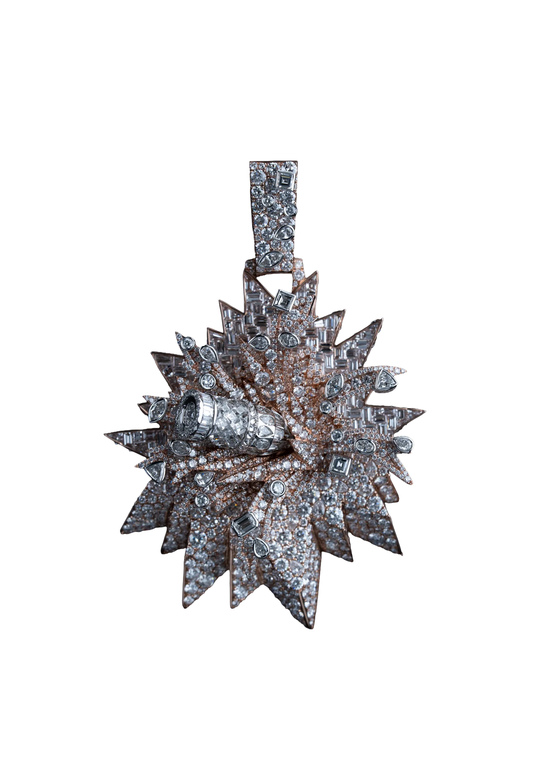 A bullet-fragment pendant in rose and white gold, its diamond-set burst radiating from a central stone.