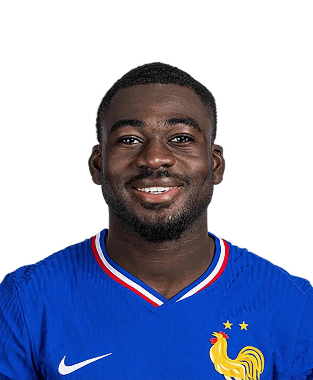 Youssouf Fofana smiling in a blue France shirt.